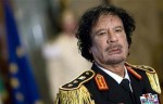 File photo of Libya's leader Gaddafi looking on during a news conference in Rome Muammar Gaddafi died