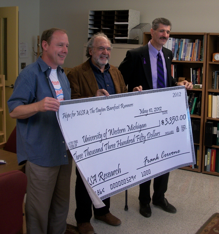 Prensenting the Check to Dr. Ide